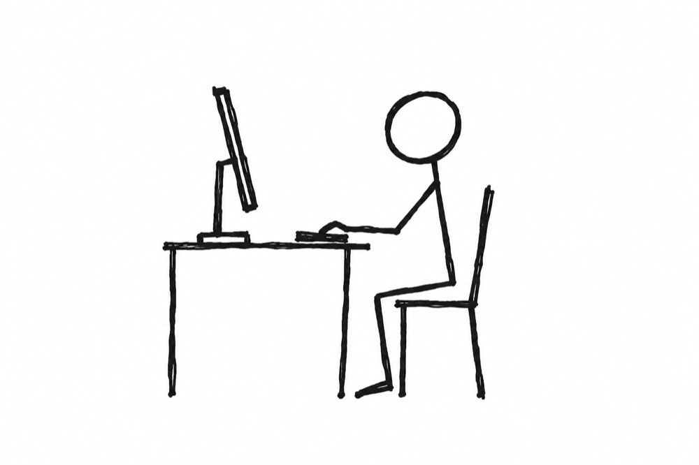 Stick figure drawing of a person working at a computer
